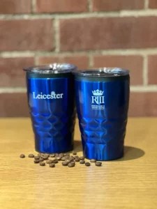 Travel Mugs with Visit Leicester and KRIII logos on them